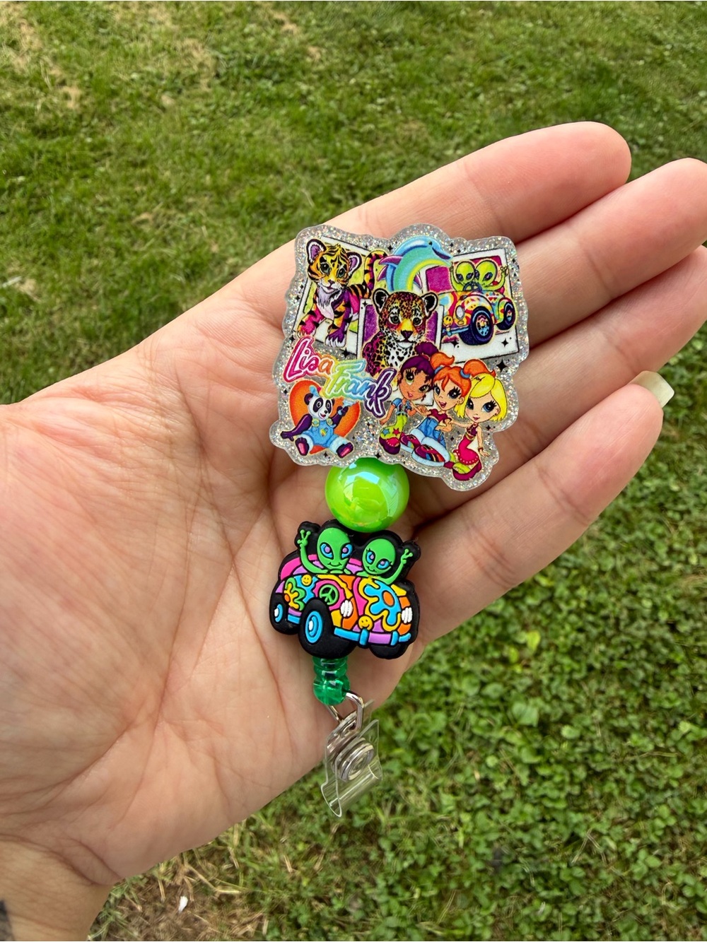 Lisa Frank Neon Green Alien Car Badge Reel with Multicolor Characters
